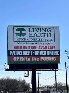 Living Earth Aubrey/Celina Open sign
